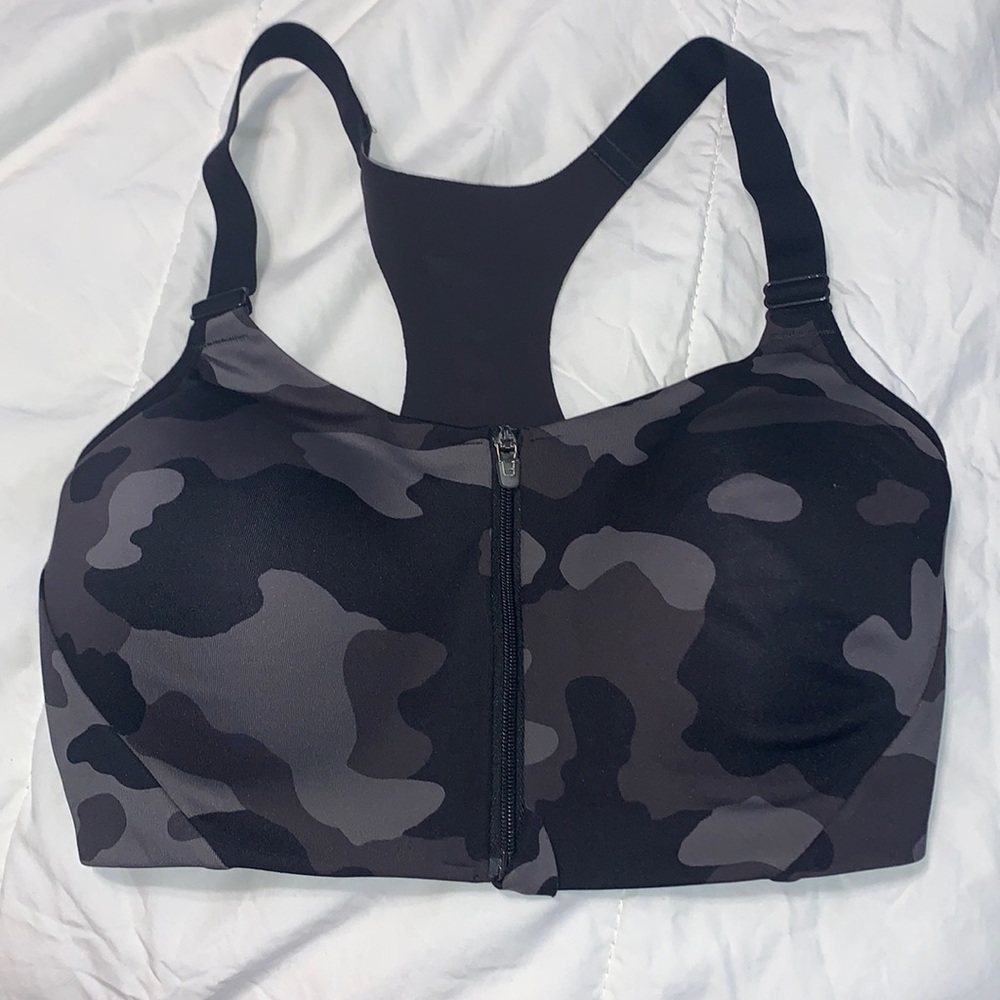 Sports bra , camp print, was only put once and didn’t fit. Zipper front